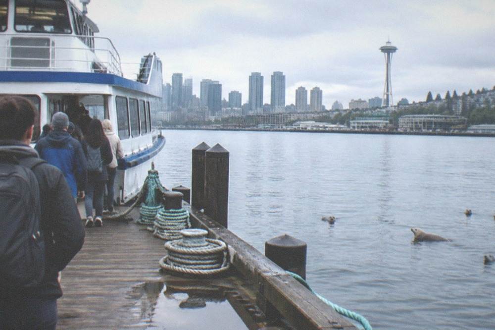 A boarding gate and ticket queue at a downtown Seattle pier before departure